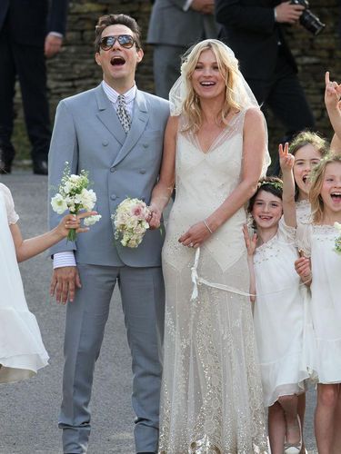 SOUTHROP, UNITED KINGDOM - JULY 01: Kate Moss and Jamie Hince pose outside the church after getting married on July 1, 2011 in Southrop, England. (Photo by Neil Mockford/FilmMagic)