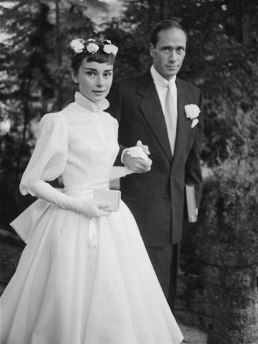 25th September 1954:  Film star couple Audrey Hepburn (1929 - 1993) and Mel Ferrer on their wedding day. Dress designed by Balmain.  (Photo by Ernst Haas/Ernst Haas/Getty Images)