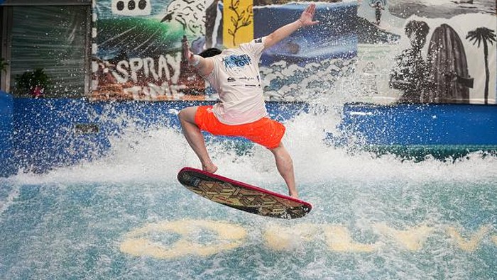 BEIJING, CHINA - JUNE 22: A man practices surfing in a Surfing Club on June 22, 2022 in Beijing, China. All sports and fitness facilities in Beijing have reopened to the public at 75 percent customer capacity. (Photo by Fred Lee/Getty Images)