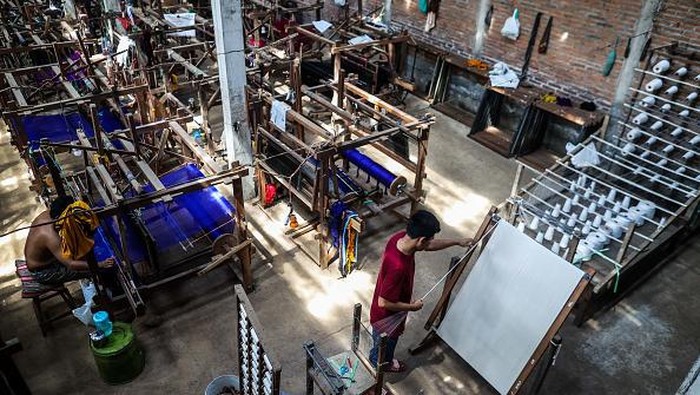 Yarns are seen at the traditional weaving workshop at Troso village in Jepara, Central Java Province, Indonesia on June 21, 2022. Textile makers in Indonesia are currently on a recovery path, after battling the COVID-19 pandemic in early 2020 until 2022. (Photo by Garry Lotulung/NurPhoto via Getty Images)
