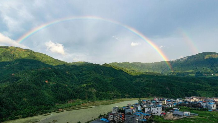 CONGJIANG, CHINA - JUNE 22, 2022 - Photo taken on June 22, 2022 shows a double rainbow landscape in Gangbian Zhuang township of Congjiang County, Southwest China's Guizhou Province. (Photo credit should read CFOTO/Future Publishing via Getty Images)