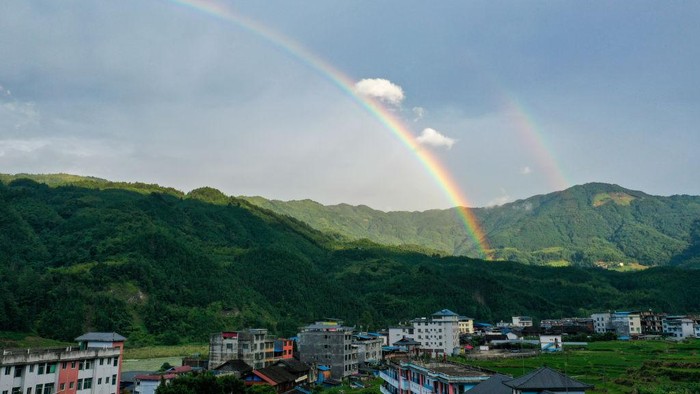 CONGJIANG, CHINA - JUNE 22, 2022 - Photo taken on June 22, 2022 shows a double rainbow landscape in Gangbian Zhuang township of Congjiang County, Southwest China's Guizhou Province. (Photo credit should read CFOTO/Future Publishing via Getty Images)