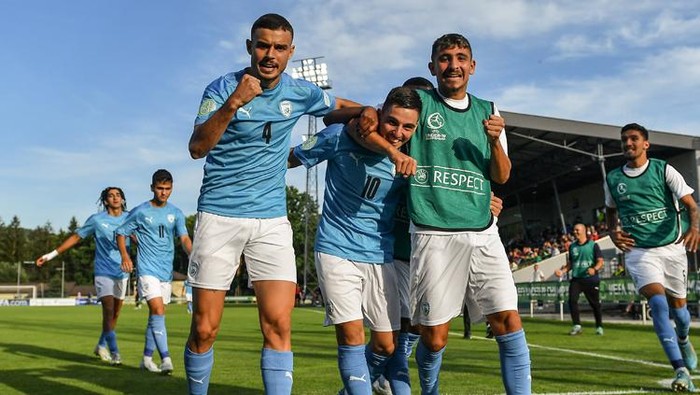 IAR NAD HRONOM, SLOVAKIA - June 22: Oscar Gloukh of Israel, centre, celebrates with teammates after scoring their sides fourth goal during the UEFA European Under-19 Championship group B match between Israel and Austria on June 22, 2022 at the iar nad Hronom Stadium in iar nad Hronom, Slovakia. (Photo by Seb Daly - UEFA/UEFA via Sportsfile)
