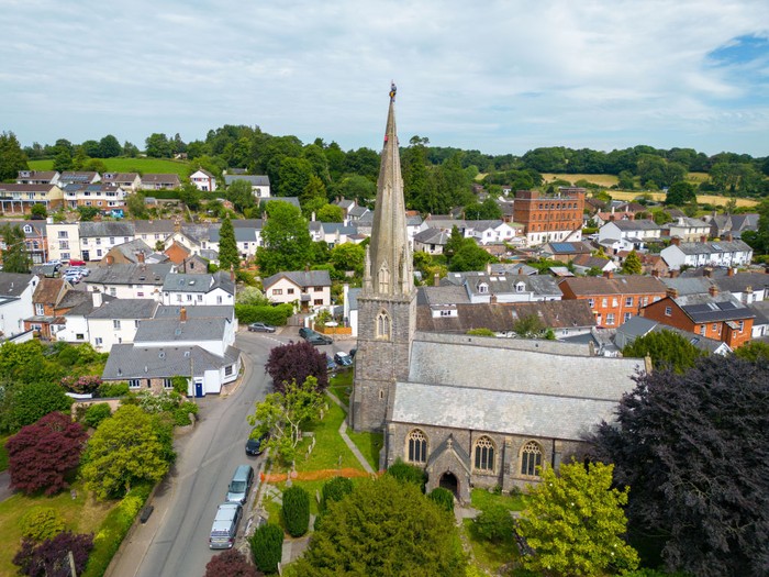UFFCULME, ENGLAND - JUNE 23: Arthur Needham from Vitruvius Building Conservation paints the lightning conductor on the steeple as part of restoration work at the top of St Mary’s Church, on June 23, 2022 in Uffculme, United Kingdom. (Photo by Finnbarr Webster/Getty Images)