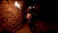 Para warga juga terlihat membawa obor saat melakukan tradisi tersebut.