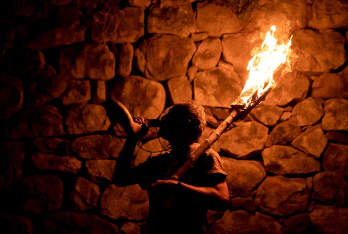 HUESCA, SPAIN - JUNE 23: A group of people descends with torches in the direction of the town during San Juan´s night on June 23, 2022 in San Juan de Plan, Huesca, Spain. The Fallas del Pirineo are festivals declared Intangible Heritage of Humanity by UNESCO. The festival is celebrated on the night of San Juan or around the summer solstice, being a tradition rooted in the Alto Aragonese town of San Juan de Plan (Photograph by Samuel de Roman/Getty Images)