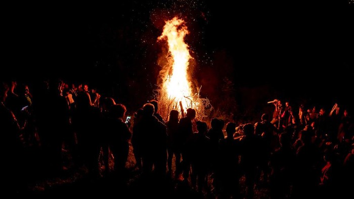 HUESCA, SPAIN - JUNE 23: A group of people descends with torches in the direction of the town during San Juan´s night on June 23, 2022 in San Juan de Plan, Huesca, Spain. The Fallas del Pirineo are festivals declared Intangible Heritage of Humanity by UNESCO. The festival is celebrated on the night of San Juan or around the summer solstice, being a tradition rooted in the Alto Aragonese town of San Juan de Plan (Photograph by Samuel de Roman/Getty Images)