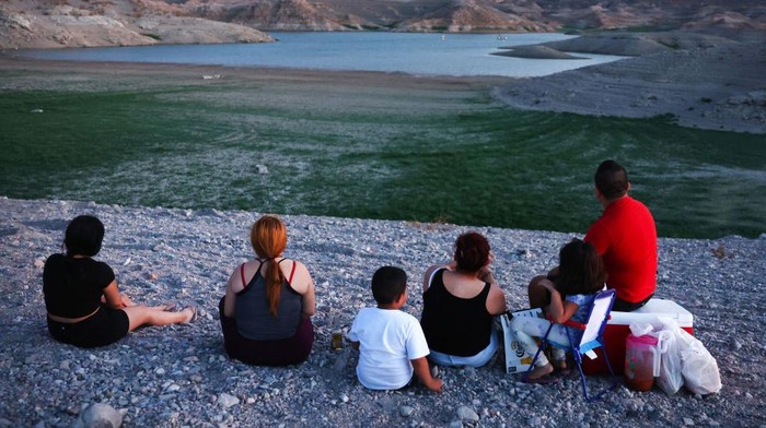 LAKE MEAD NATIONAL RECREATION AREA, NEVADA - JUNE 23: Grass grows on a now-dry section of lakebed at the drought-stricken Lake Mead on June 23, 2022 in the Lake Mead National Recreation Area, Nevada. The U.S. Bureau of Reclamation reported that Lake Mead, North America's largest artificial reservoir, has dropped to about 1,044 feet above sea level, the lowest it's been since being filled in 1937 after the construction of the Hoover Dam. The declining water levels are a result of a climate change-fueled megadrought coupled with increased water demands in the Southwestern United States. Fears are increasing that Lake Mead could in years ahead become a ‘dead pool’, when the water levels become too low to flow downstream from nearby Hoover Dam. (Photo by Mario Tama/Getty Imag