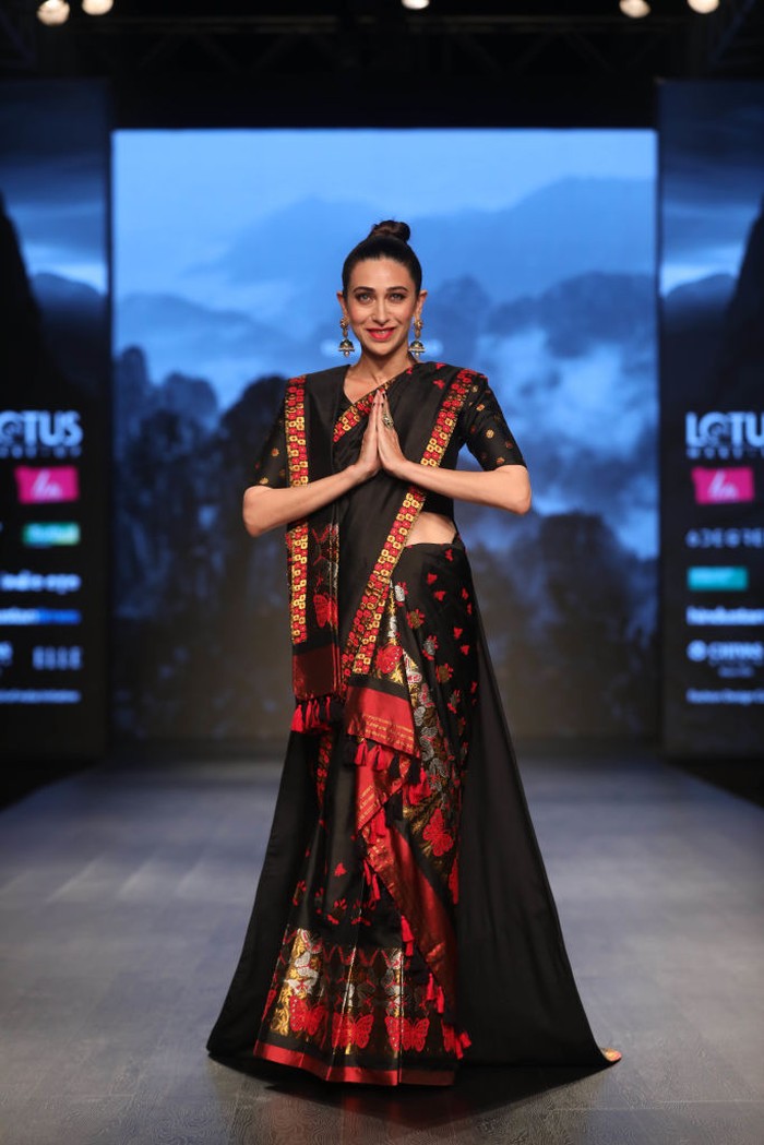 1132481590 NEW DELHI, INDIA MARCH 14: Bollywood actor Karisma Kapoor walks the ramp for Morom by Designer Sanjukta Dutta at Lotus Make-Up India Fashion Week Autumn Winter' 2019, at Jawahar Lal Nehru Stadium, on March 14, 2019 in New Delhi, India. (Photo by Raajessh Kashyap/Hindustan Times via Getty Images)