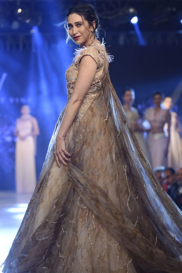 In this photo taken on November 19, 2019, Bollywood actress Karisma Kapoor walks on a ramp during a fashion show at a hotel on the outskirts of Amritsar (Photo by NARINDER NANU / AFP) (Photo by NARINDER NANU/AFP via Getty Images)