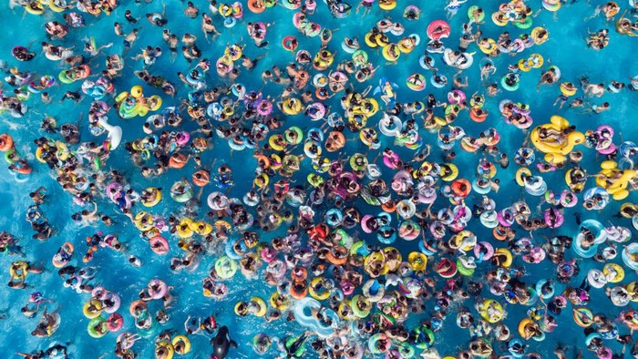 NANJING, CHINA - JUNE 25: Aerial view of people enjoying themselves at a swimming pool to beat the heat on June 25, 2022 in Nanjing, Jiangsu Province of China. (Photo by Xue Jinlong/VCG via Getty Images)