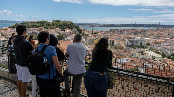 People are seen walking in the vicinity of the Nossa Senhora de Monte viewpoint, Lisbon. June 24, 2022. The European Centre for Disease Prevention and Control (ECDC) has shared maps of the progression of COVID-19 infections. The pandemic situation in Portugal remains unchanged, and the country has once again been painted dark red, the color that corresponds to having more than 300 positive COVID-19 cases per 100,000 population. (Photo by Jorge Mantilla/NurPhoto via Getty Images)
