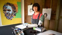 GLASTONBURY, ENGLAND - JUNE 23: Ai-DA, the worlds first robot artist, paints portraits of the headline acts, including Kendrick Lamar, in the Ai-DA Robot Booth in the Shangri La Field, during day two of Glastonbury Festival at Worthy Farm, Pilton on June 23, 2022 in Glastonbury, England. (Photo by Leon Neal/Getty Images)