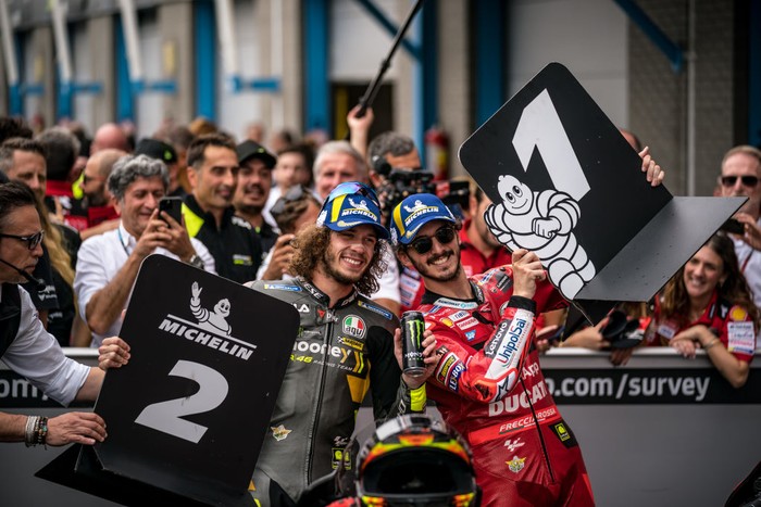 ASSEN, NETHERLANDS - JUNE 26: Marco Bezzecchi of Italy and Mooney VR46 Racing Team and Francesco Bagnaia of Italy and Ducati Lenovo Team celebrates at parc ferm during the race of the MotoGP Motul TT Assen at TT Circuit Assen on June 26, 2022 in Assen, Netherlands. (Photo by Steve Wobser/Getty Images)