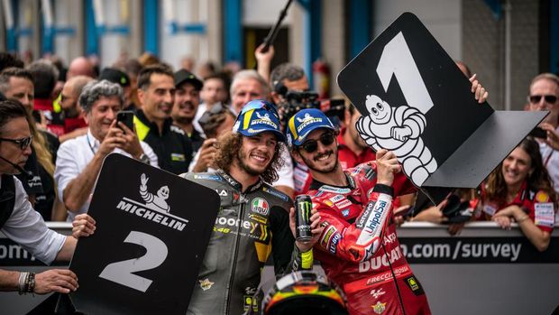 ASSEN, NETHERLANDS - JUNE 26: Marco Bezzecchi of Italy and Mooney VR46 Racing Team and Francesco Bagnaia of Italy and Ducati Lenovo Team celebrates at parc ferm during the race of the MotoGP Motul TT Assen at TT Circuit Assen on June 26, 2022 in Assen, Netherlands. (Photo by Steve Wobser/Getty Images)