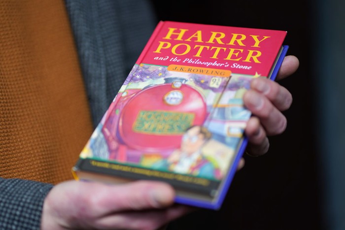 A pristine first edition hardback of JK Rowling's Harry Potter and the Philosopher's Stone, one of only 500 produced in the first print run in 1997, on display at Hansons' Auctioneers at Bishton Hall, Staffordshire. The book has never been read and was kept in darkness for 25 years inside a protective sleeve and could fetch up to £100,000 when it goes under the hammer at Hanson's Library Auction on March 9. Picture date: Monday March 7, 2022. (Photo by Jacob King/PA Images via Getty Images)