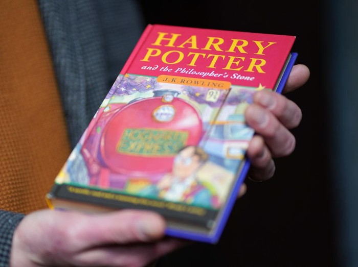 A pristine first edition hardback of JK Rowlings Harry Potter and the Philosophers Stone, one of only 500 produced in the first print run in 1997, on display at Hansons Auctioneers at Bishton Hall, Staffordshire. The book has never been read and was kept in darkness for 25 years inside a protective sleeve and could fetch up to £100,000 when it goes under the hammer at Hansons Library Auction on March 9. Picture date: Monday March 7, 2022. (Photo by Jacob King/PA Images via Getty Images)