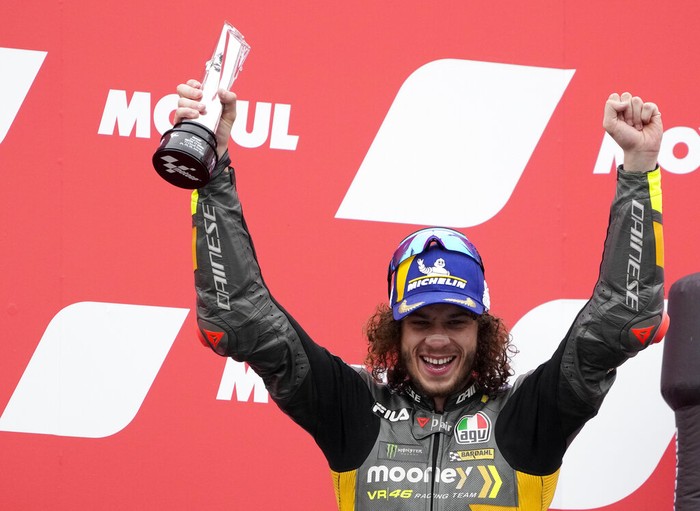 Marco Bezzecchi Second placed Italian rider Marco Bezzecchi of the Mooney VR46 Racing Team celebrates with trophy on the podium after the MotoGP race at the Dutch Grand Prix in Assen, northern Netherlands, Sunday, June 26, 2022. (AP Photo/Peter Dejong)