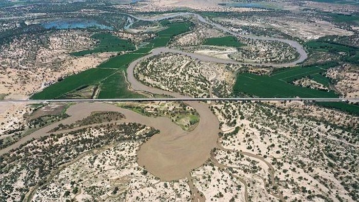 BAZHOU, CHINA - JUNE 26, 2022 - Aerial photo taken on June 26, 2022 shows the beauty of a desert highway in Bazhou, Xinjiang Province, China. Construction of the Desert Highway from Yuli County to Qiemo County in Xinjiang began in October 2017, with a total length of 334 kilometers, of which 307 kilometers are desert sections. It is the desert highway with the longest mileage, the widest distribution of mobile dunes, the worst construction conditions and the most difficult construction in the world. It will be open to traffic on June 30, 2022. (Photo credit should read CFOTO/Future Publishing via Getty Images)