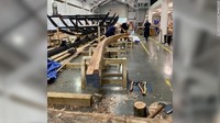 Tugas mereka merekonstruksi kapal seakurat mungkin dengan teknik dari Anglo-Saxon, seperti menggunakan kapak untuk membentuk kayu.  (The Sutton Hoo Ship Company)