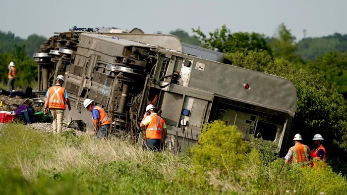 In this photo provided by Dax McDonald, debris sits near railroad tracks after an Amtrak passenger train derailed near Mendon, Mo., on Monday, June 27, 2022. The Southwest Chief, traveling from Los Angeles to Chicago, was carrying about 243 passengers when it collided with a dump truck near Mendon, Amtrak spokeswoman Kimberly Woods said. (Dax McDonald via AP)