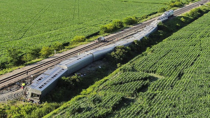 In this photo provided by Dax McDonald, debris sits near railroad tracks after an Amtrak passenger train derailed near Mendon, Mo., on Monday, June 27, 2022. The Southwest Chief, traveling from Los Angeles to Chicago, was carrying about 243 passengers when it collided with a dump truck near Mendon, Amtrak spokeswoman Kimberly Woods said. (Dax McDonald via AP)