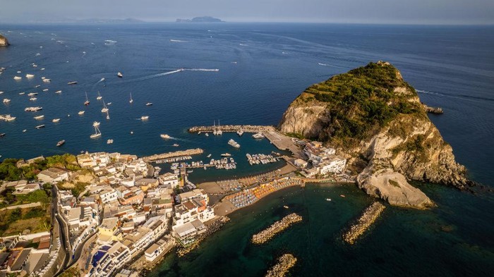 1241573257 A drone view of Sant'Angelo d'Ischia, in Ischia, Italy, on June 26, 2022. Ischia is a volcanic island in the Gulf of Naples, Italy. It's known for its mineral-rich thermal waters. (Photo by Manuel Romano/NurPhoto via Getty Images)