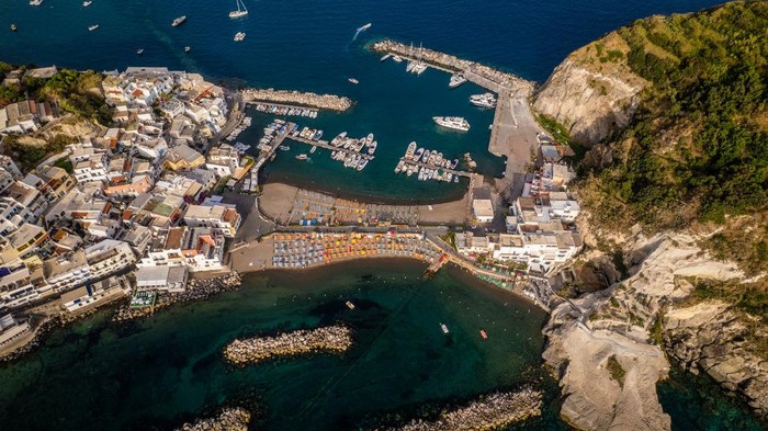 1241573257 A drone view of Sant'Angelo d'Ischia, in Ischia, Italy, on June 26, 2022. Ischia is a volcanic island in the Gulf of Naples, Italy. It's known for its mineral-rich thermal waters. (Photo by Manuel Romano/NurPhoto via Getty Images)