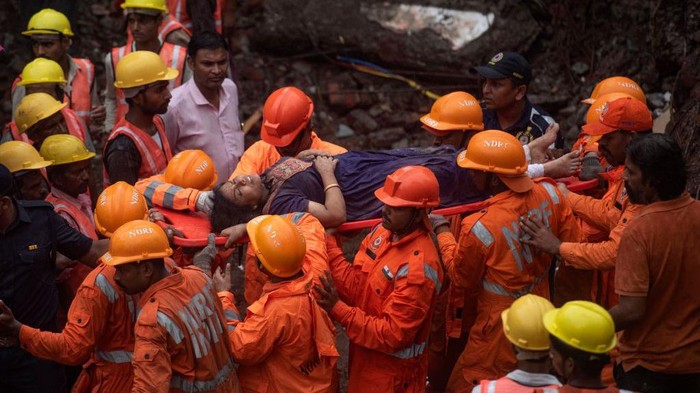MUMBAI, INDIA JUNE 28: Rescue operations underway as 14 people died and 23 rescued after a four-storey building collapsed late Monday night at Naik Nagar, Kurla (East), on June 28, 2022 in Mumbai, India. A wing of the building located in Naik Nagar society collapsed while another wing was evacuated as it too is dilapidated, said officials of the Brihanmumbai Municipal Corporation (BMC). (Photo by Satish Bate/Hindustan Times via Getty Images)