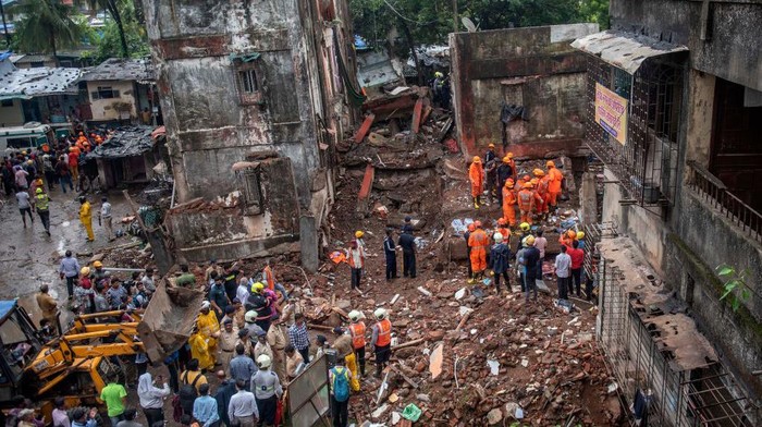 1241593035 MUMBAI, INDIA JUNE 28: Rescue operations underway as 14 people died and 23 rescued after a four-storey building collapsed late Monday night at Naik Nagar, Kurla (East), on June 28, 2022 in Mumbai, India. A wing of the building located in Naik Nagar society collapsed while another wing was evacuated as it too is dilapidated, said officials of the Brihanmumbai Municipal Corporation (BMC). (Photo by Satish Bate/Hindustan Times via Getty Images)