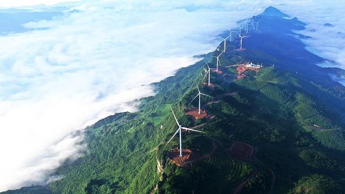 CHONGQING, CHINA - JUNE 28, 2022 - Clouds wrap around the Wufuling Wind Farm in Chongqing, Southwest China, June 28, 2022. (Photo credit should read CFOTO/Future Publishing via Getty Images)