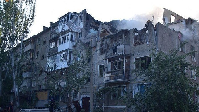 A rescuer stands next to a residential building hit by a Russian military strike, as Russias attack on Ukraine continues, in Mykolaiv, Ukraine June 29, 2022. Press service of the State Emergency Service of Ukraine/Handout via REUTERS