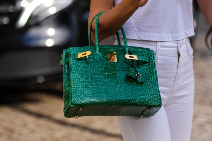 CANNES, FRANCE - MAY 24: Close-up view of a green crocodile pattern Hermes Birkin leather bag, on May 24, 2022 in Cannes, France. (Photo by Edward Berthelot/Getty Images)