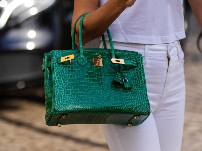 CANNES, FRANCE - MAY 24: Close-up view of a green crocodile pattern Hermes Birkin leather bag, on May 24, 2022 in Cannes, France. (Photo by Edward Berthelot/Getty Images)