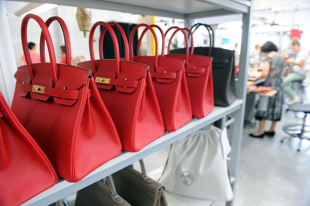TO GO WITH AFP STORY BY REGINE LAMOTHEA photo taken on June 11, 2015 shows Hermes Birkin bags at the Maroquinerie de la Tardoire, a Hermes workshop specialized in products made with calfskin, in Montbron, southwestern France. AFP PHOTO / MEHDI FEDOUACH (Photo by Mehdi FEDOUACH / AFP) (Photo by MEHDI FEDOUACH/AFP via Getty Images)