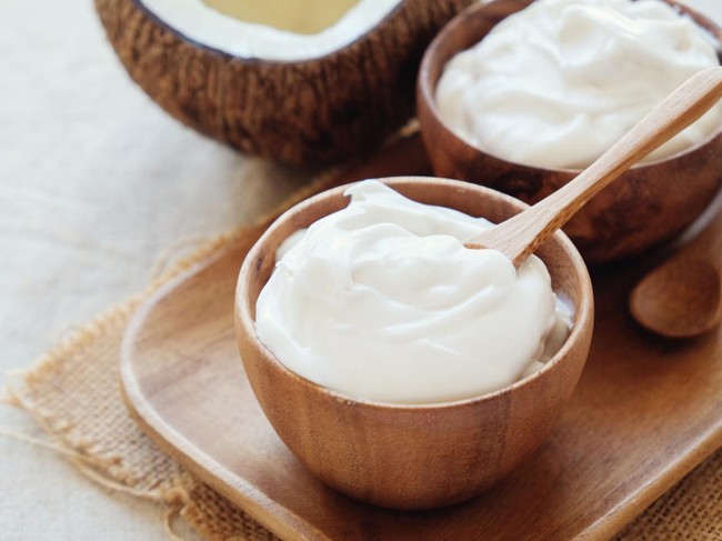 homemade organic coconut greek yogurt in wooden bowl
