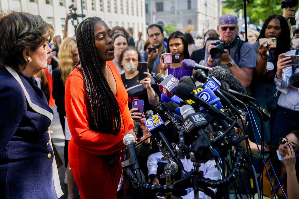 Jovante Cunningham pauses after addressing members of the media outside federal court, Wednesday, June 29, 2022, in the Brooklyn borough of New York. R&B star R. Kelly was sentenced to 30 years in prison Wednesday in a federal sex trafficking case in New York. (AP Photo/John Minchillo)
