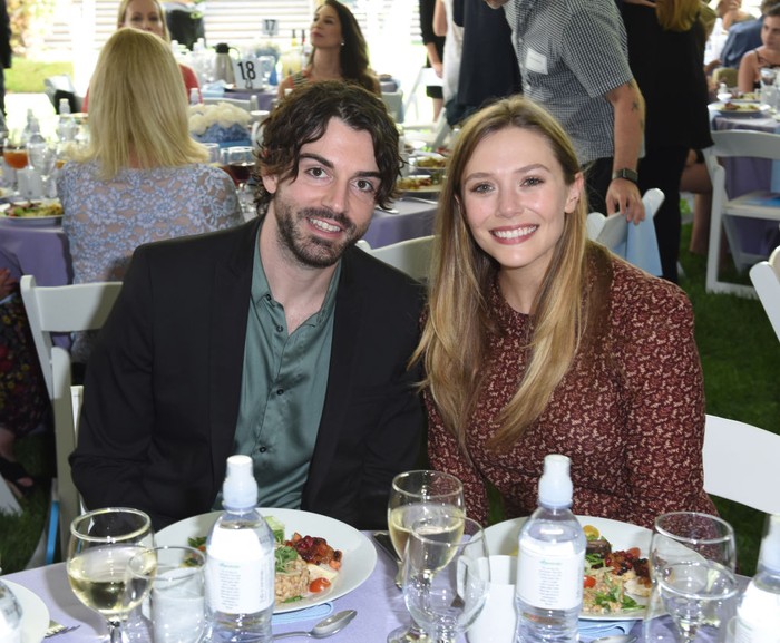 859137628 BEVERLY HILLS, CA - OCTOBER 08: Robbie Arnett and Elizabeth Olsen attend The Rape Foundation's Annual Brunch on October 8, 2017 in Beverly Hills, California (Photo by Vivien Killilea/Getty Images for The Rape Foundation)