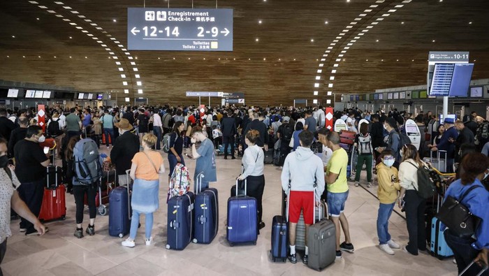 Unionists strikers demonstrate outside a terminal Friday, July 1, 2022 at Roissy airport, north of Paris. Flights from Charles de Gaulle airport in Paris and other French airports faced disruptions Friday as airport workers held a strike and protests to demand salary hikes to keep up with inflation. Its the latest trouble to hit global airports this summer, as travel resurges after two years of virus restrictions. (AP Photo/ Thomas Padilla)