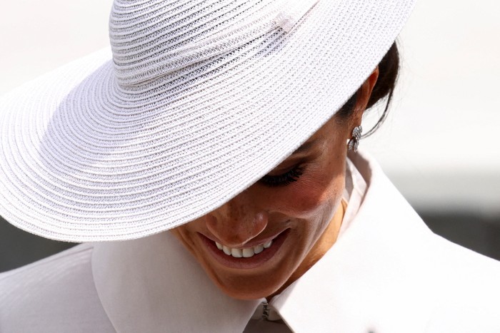 Meghan Markle Britains Meghan, Duchess of Sussex, leaves at the end of the National Service of Thanksgiving for The Queens reign at Saint Pauls Cathedral in London on June 3, 2022 as part of Queen Elizabeth IIs platinum jubilee celebrations. - Queen Elizabeth II kicked off the first of four days of celebrations marking her record-breaking 70 years on the throne, to cheering crowds of tens of thousands of people. But the 96-year-old sovereigns appearance at the Platinum Jubilee -- a milestone never previously reached by a British monarch -- took its toll, forcing her to pull out of a planned church service. (Photo by HENRY NICHOLLS / POOL / AFP) (Photo by HENRY NICHOLLS/POOL/AFP via Getty Images)