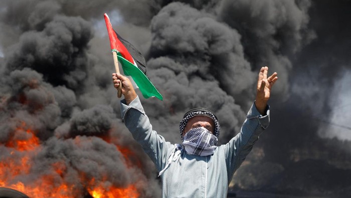 Palestinians protest against Israeli settlement activity in Kafr Qaddum in the Israeli-occupied West Bank July 1, 2022. REUTERS/Raneen Sawafta