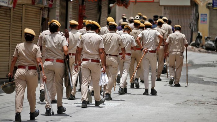 Members of the police patrol a street during restrictions imposed by authorities after the killing of Kanhaiya Lal Teli, a Hindu tailor, carried out by two suspected Muslim men who filmed the act and posted it online, in Udaipur in the northwestern state of Rajasthan, India, July 1, 2022. REUTERS/Amit Dave