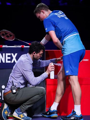 PARIS, FRANCE - OCTOBER 26: Viktor Axelsen(R) of Denmark receives treatment for cramp during the Men's Singles semi finals match against Jonatan Christie of Indonesia on day five of the French Open at Stade Pierre de Coubertin on October 26, 2019 in Paris, France. (Photo by Shi Tang/Getty Images)
