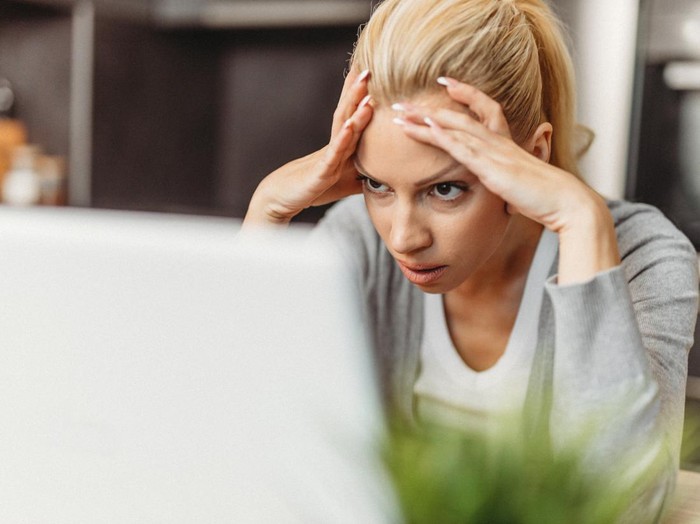 1275959432. Woman working from home.