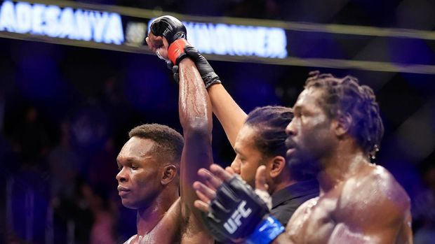 LAS VEGAS, NEVADA - JULY 02: Israel Adesanya (L) of Nigeria celebrates his unanimous decision win over Jared Cannonier in their middleweight title bout during UFC 276 at T-Mobile Arena on July 02, 2022 in Las Vegas, Nevada. (Photo by Carmen Mandato/Getty Images)