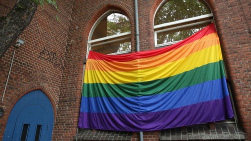 A rainbow flag hangs outside the Ibn Rushd-Goethe mosque in Berlin, Germany on July 1, 2022. - The flag was hoisted prior to Friday prayers in order to set a sign, especially for members of the muslim community, that they dont have to choose between their faith and their sexual identity, but are accepted as they are. (Photo by Adam BERRY / AFP) (Photo by ADAM BERRY/AFP via Getty Images)