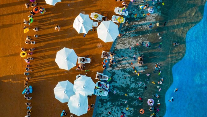 1406668506 HUAI'AN, CHINA - JULY 03: Aerial view of tourists enjoying themselves at a water park on a summer day on July 3, 2022 in Huai'an, Jiangsu Province of China. (Photo by VCG/VCG via Getty Images)