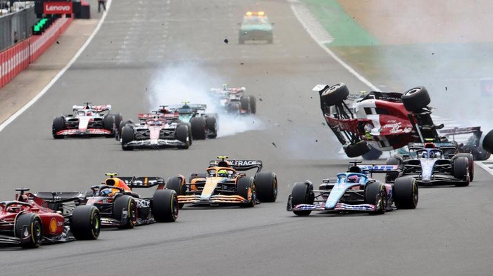 Formula One F1 - British Grand Prix - Silverstone Circuit, Silverstone, Britain - July 3, 2022 Alfa Romeo's Guanyu Zhou crashes out at the start of the race REUTERS/Molly Darlington     TPX IMAGES OF THE DAY