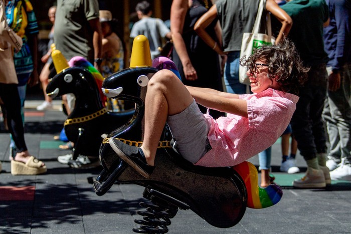 NEW YORK, NEW YORK - JUNE 29: A child plays on artist Derrick Adams's newly installed Funtime Unicorns at the Channel Garden in Rockefeller Center on June 29, 2022 in New York City. The Funtime Unicorns installation will be in Rockefeller Center until September 9th. (Photo by Roy Rochlin/Getty Images)