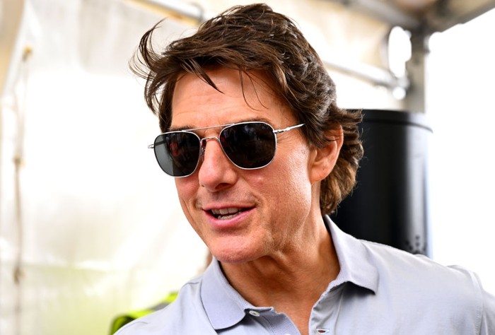 NORTHAMPTON, ENGLAND - JULY 03: Tom Cruise walks in the Paddock prior to the F1 Grand Prix of Great Britain at Silverstone on July 03, 2022 in Northampton, England. (Photo by Clive Mason/Getty Images)